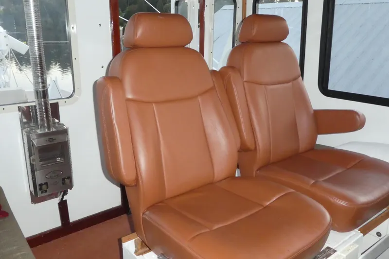 Slide: The Image of Brown leather seats inside a 1979 Hiptimco 40' Trawler boat cabin. - 34
