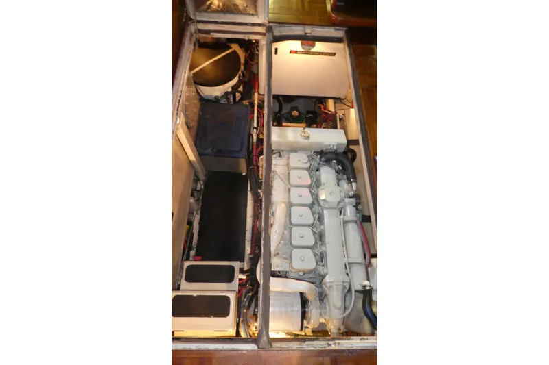 Slide: The Image of Engine compartment of 1979 Hiptimco 40' Trawler, showcasing mechanical components and wiring. - 36