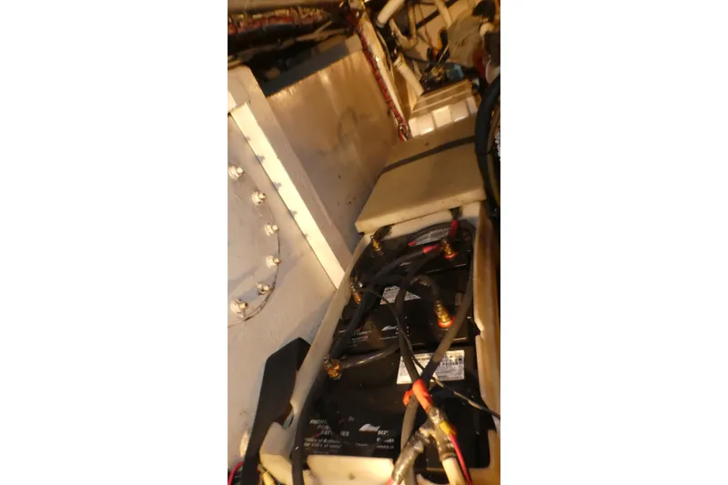 Slide: The Image of Engine room of 1979 Hiptimco 40' Trawler showing battery and wiring. - 39