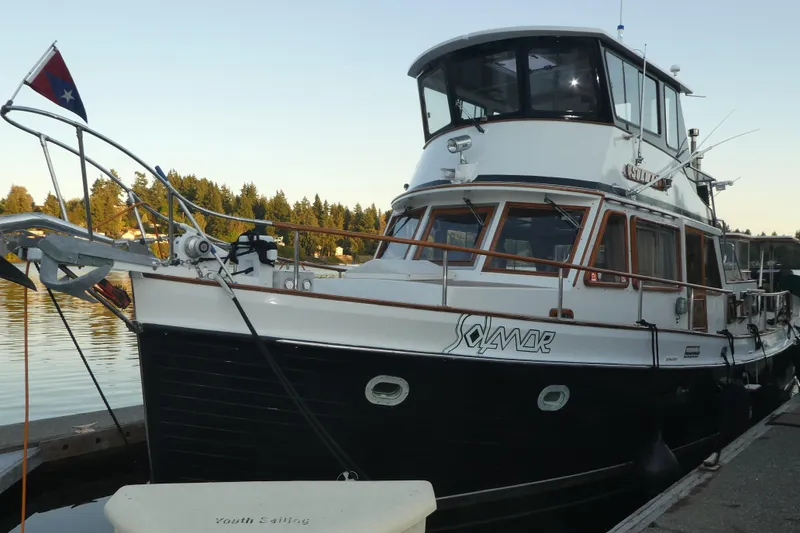 Slide: The Image of 1979 Hiptimco 40' Trawler docked, featuring classic design and nautical charm. - 4