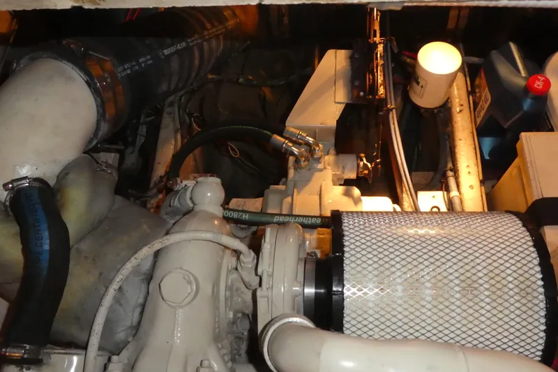 Slide: The Image of Engine room of 1979 Hiptimco 40' Trawler, showcasing mechanical components and filters. - 43