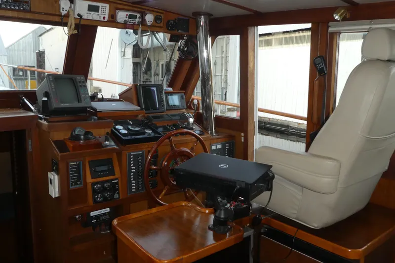 Slide: The Image of Interior of 1979 Hiptimco 40' Trawler with navigation equipment and captain's chair. - 5
