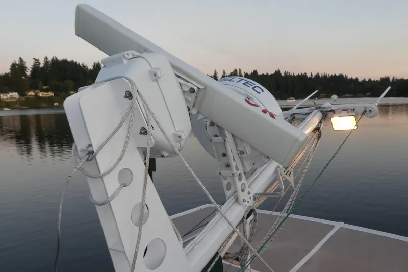 Slide: The Image of 1979 Hiptimco 40' Trawler radar equipment on calm water at sunset. - 50