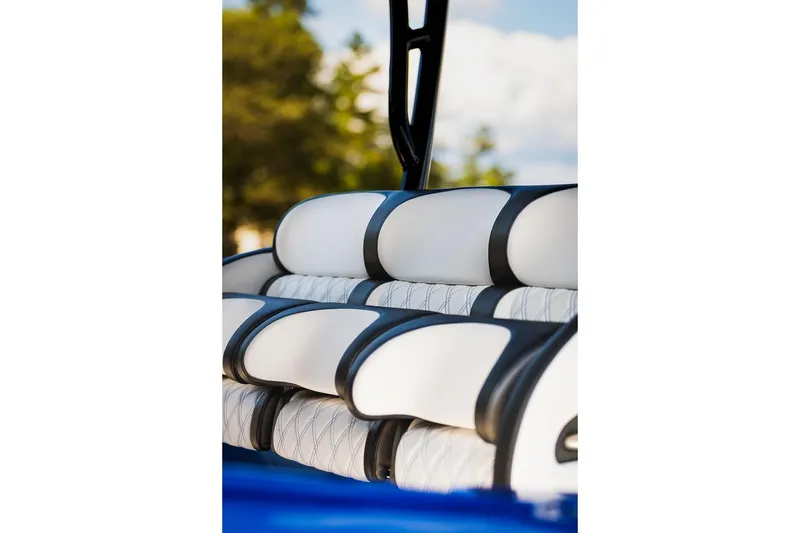 Slide: The Image of 2025 Nor-Tech 340 Sport Center Console, luxurious white and black seating detail. - 24