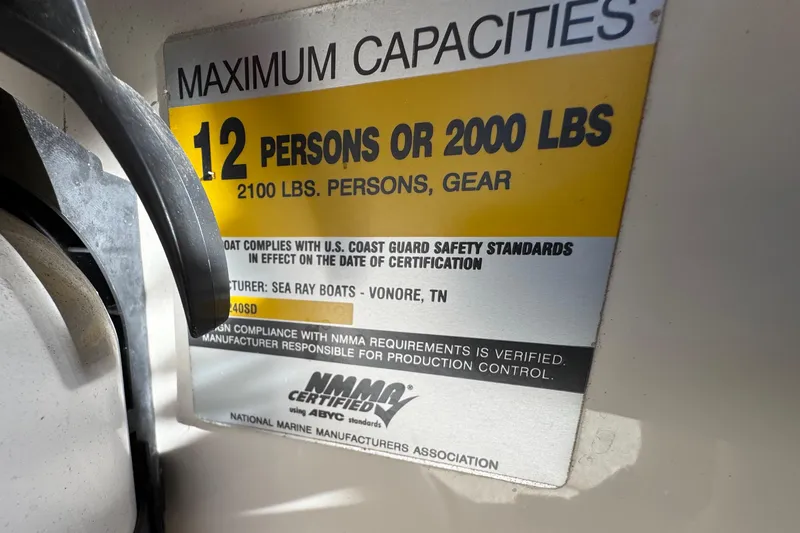 Slide: The Image of 2005 Sea Ray 240 Sundeck capacity label, 12 persons or 2000 lbs, NMMA certified. - 28
