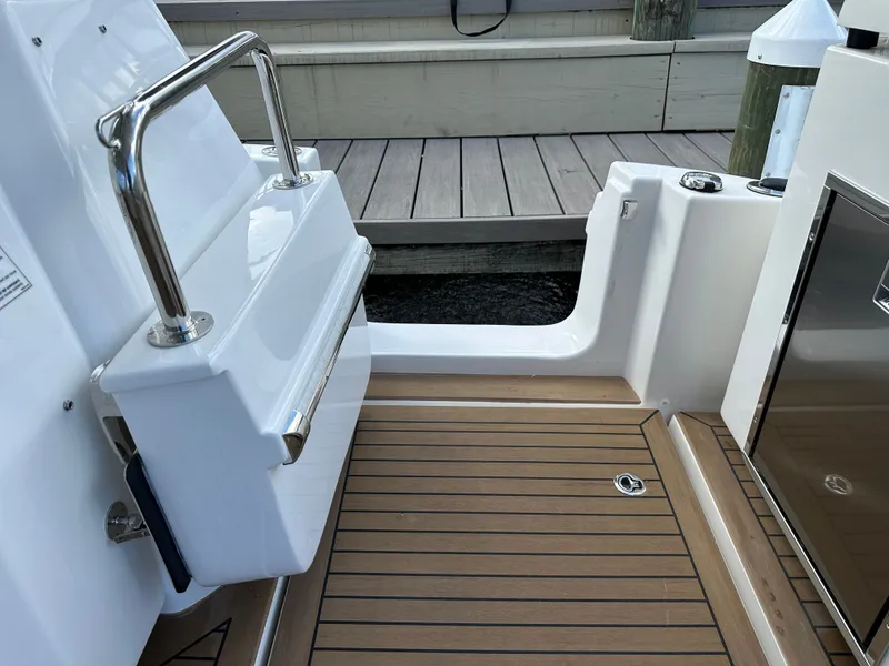 Slide: The Image of Aquila 36 Sport 2025 boat deck with sleek design and stainless steel railing. - 17