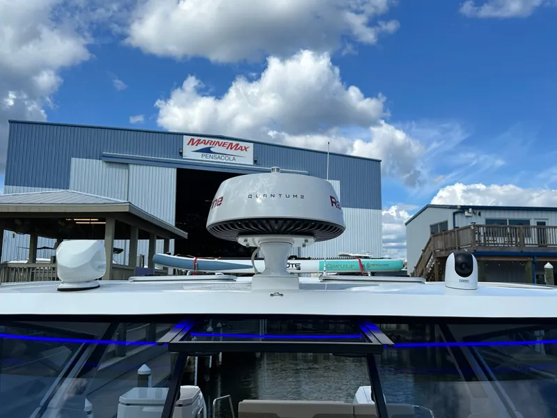 Slide: The Image of 2025 Aquila 36 Sport at MarineMax Pensacola, under a blue sky. - 25