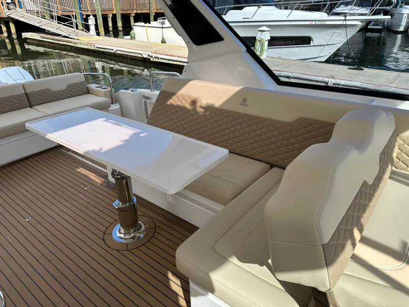 Slide: The Image of Luxurious seating area on 2025 Aquila 36 Sport yacht with elegant design and waterfront view. - 28
