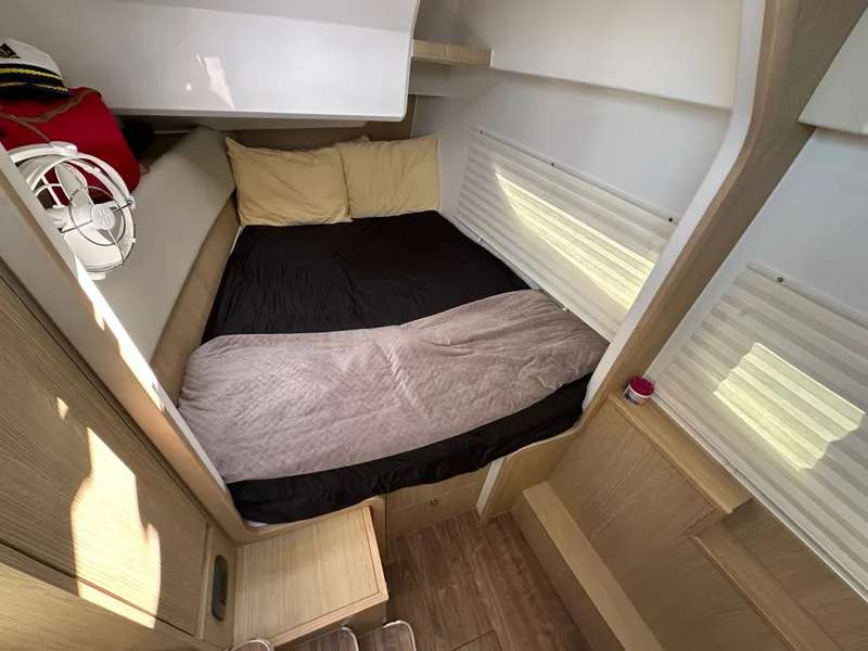 Slide: The Image of Cozy cabin interior of 2025 Aquila 36 Sport with bed and wooden accents. - 30