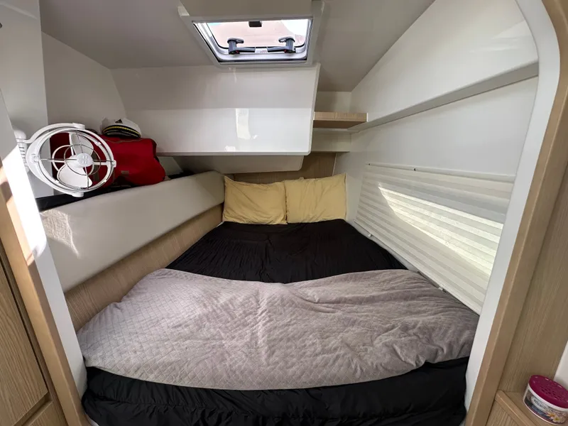 Slide: The Image of Cozy cabin interior of 2025 Aquila 36 Sport with bed and fan. - 32