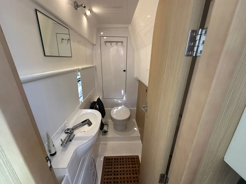 Slide: The Image of Modern bathroom interior of 2025 Aquila 36 Sport yacht, featuring sleek design and compact amenities. - 33
