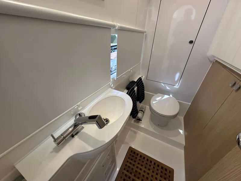 Slide: The Image of Bathroom interior of 2025 Aquila 36 Sport yacht, featuring modern sink and toilet. - 35