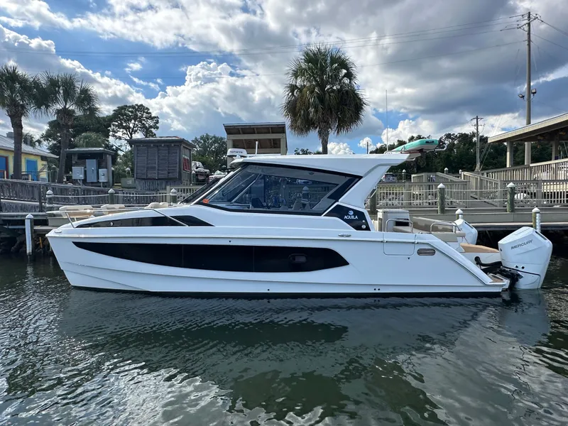 Slide: The Image of 2025 Aquila 36 Sport boat docked, featuring sleek design and modern amenities. - 4