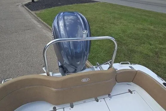 Slide: The Image of 2023 Sea Hunt Ultra 234 boat with tan cushioned seating. - 14