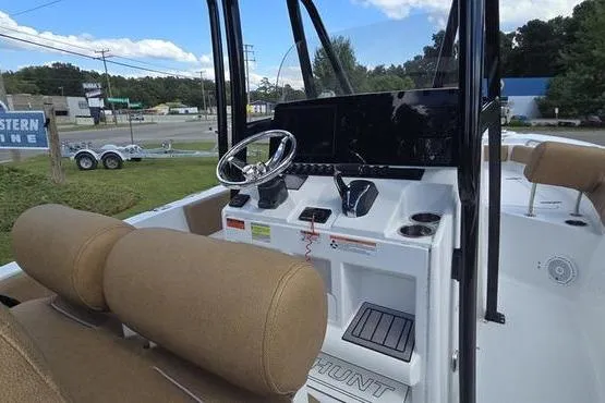 Slide: The Image of 2023 Sea Hunt Ultra 234 boat interior with tan seating and sleek design. - 17