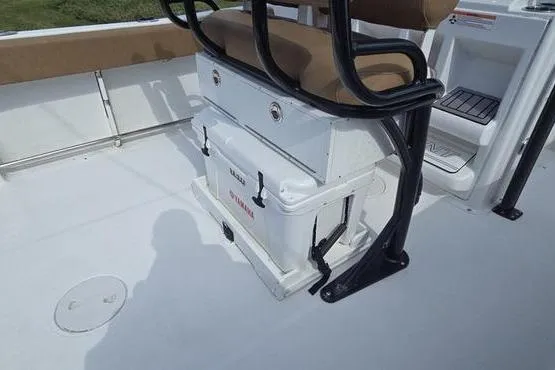 Slide: The Image of 2023 Sea Hunt Ultra 234 boat interior with seating and storage area. - 2