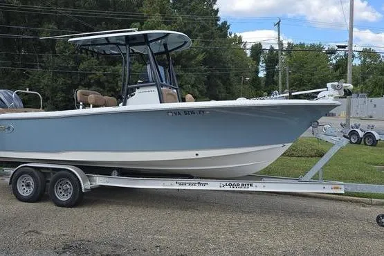 Slide: The Image of 2023 Sea Hunt Ultra 234 boat on trailer, parked outdoors. - 4