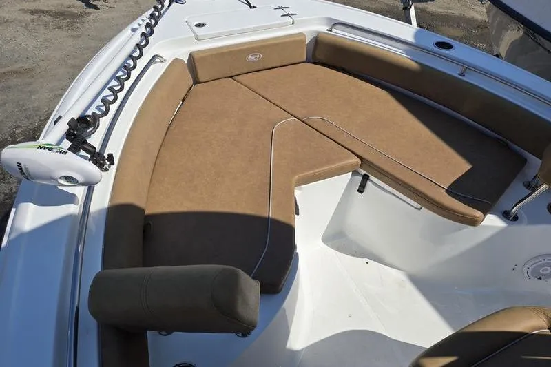 Slide: The Image of 2023 Sea Hunt Ultra 234 boat interior storage compartment with gear and equipment. - 9