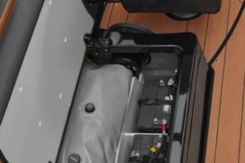 Slide: The Image of 2026 Yamaha Boats 255XD engine compartment with visible components and wiring. - 4