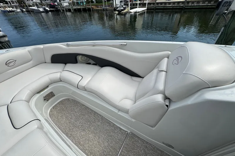 Slide: The Image of 2015 Crownline 285 SS boat interior with plush seating by the water. - 17