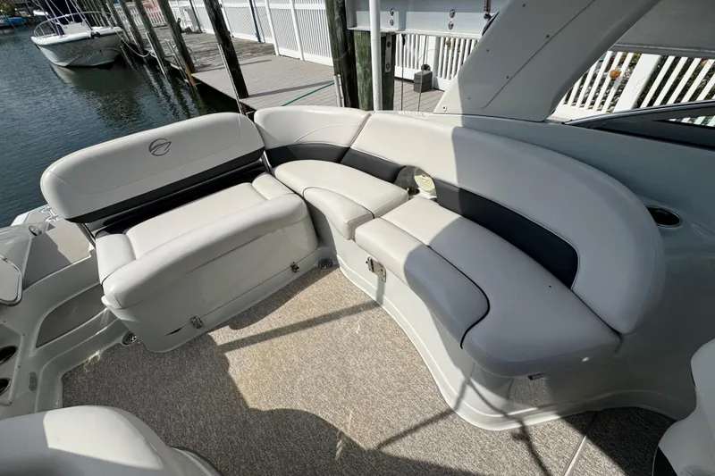Slide: The Image of 2015 Crownline 285 SS boat interior with plush seating and elegant design. - 33