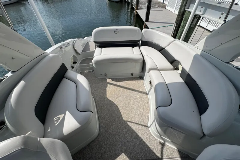 Slide: The Image of 2015 Crownline 285 SS boat interior with spacious seating and elegant design. - 34