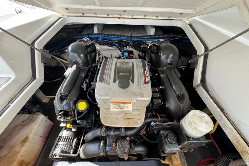 Slide: The Image of Engine compartment of a 2015 Crownline 285 SS boat, featuring a MerCruiser 350 engine. - 37