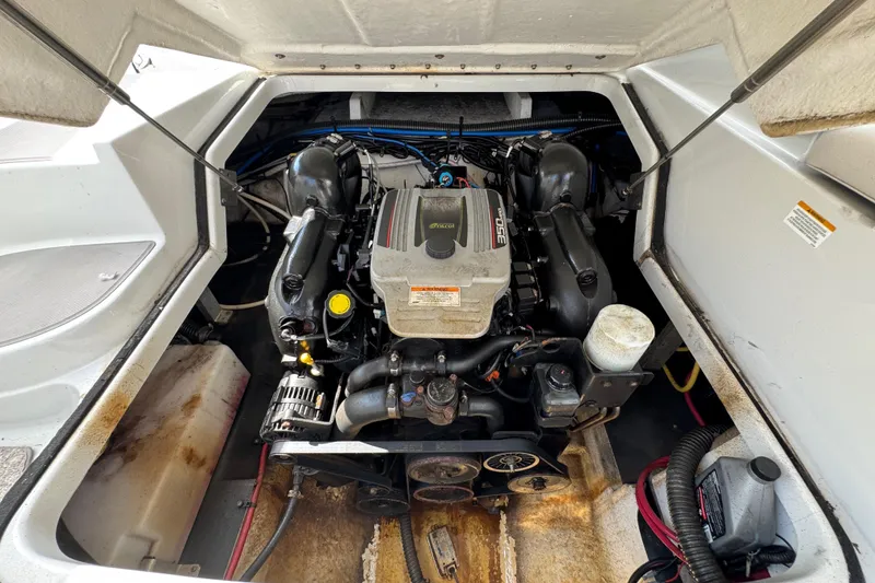 Slide: The Image of Engine compartment of a 2015 Crownline 285 SS boat, showcasing the motor and components. - 40