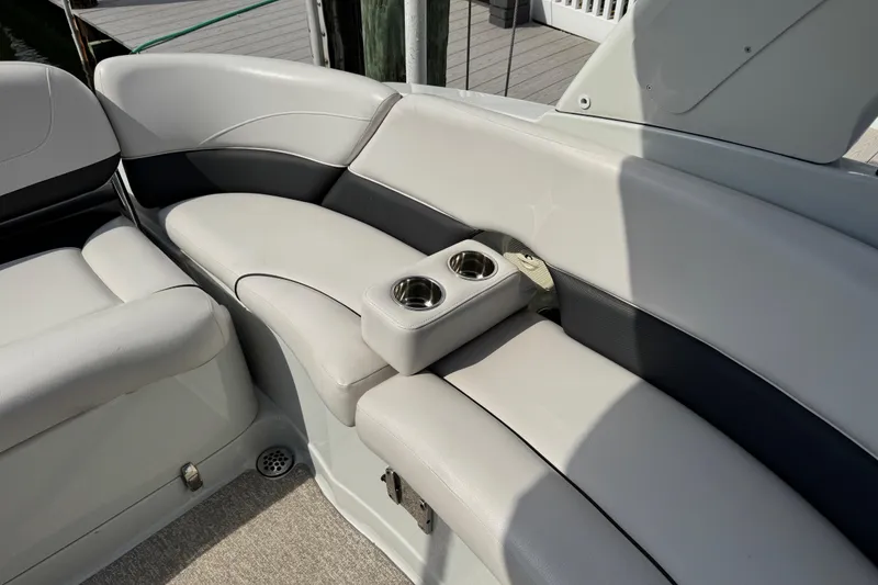 Slide: The Image of Crownline 285 SS 2015 boat interior with cushioned seating and cup holders. - 41