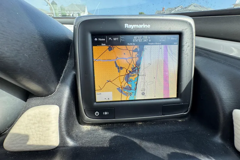 Slide: The Image of Raymarine navigation display on 2015 Crownline 285 SS boat dashboard. - 57