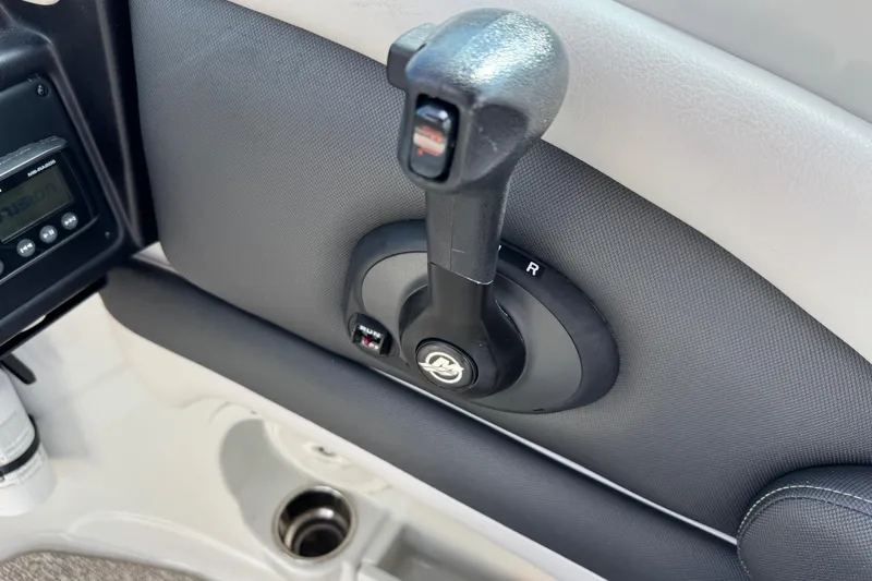 Slide: The Image of Throttle control of 2015 Crownline 285 SS boat, featuring a sleek design. - 60