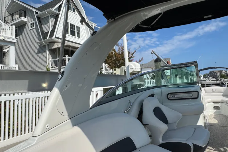 Slide: The Image of 2015 Crownline 285 SS boat interior with modern seating and sleek design. - 66