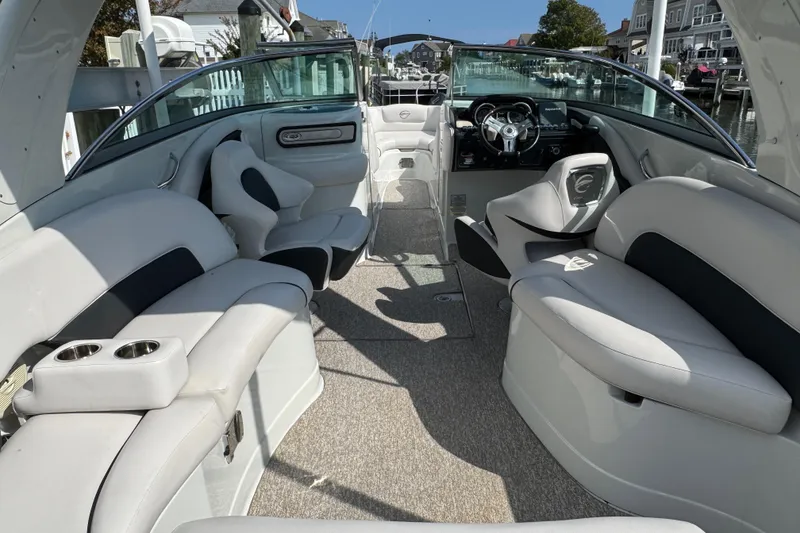 Slide: The Image of 2015 Crownline 285 SS boat interior with luxurious seating and modern dashboard. - 67