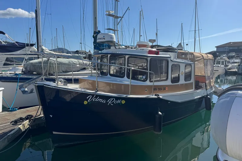 The Image of 2016 Ranger Tugs R-25SC boat docked at marina, sunny day. - 0