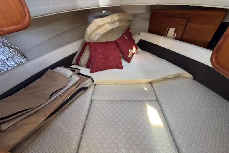 Slide: The Image of 2016 Ranger Tugs R-25SC cabin interior with cushions and pillows. - 2