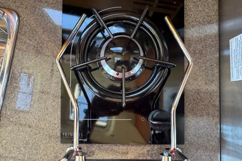 Slide: The Image of Stovetop on 2016 Ranger Tugs R-25SC boat, featuring a single burner and sleek design. - 24