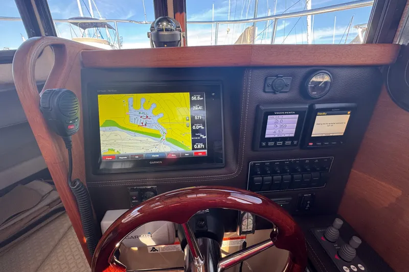 Slide: The Image of 2016 Ranger Tugs R-25SC helm with Garmin navigation display and control panels. - 4