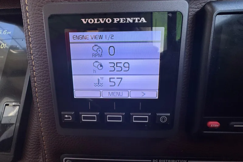 Slide: The Image of Volvo Penta engine display on 2016 Ranger Tugs R-25SC showing RPM, hours, and temperature. - 6