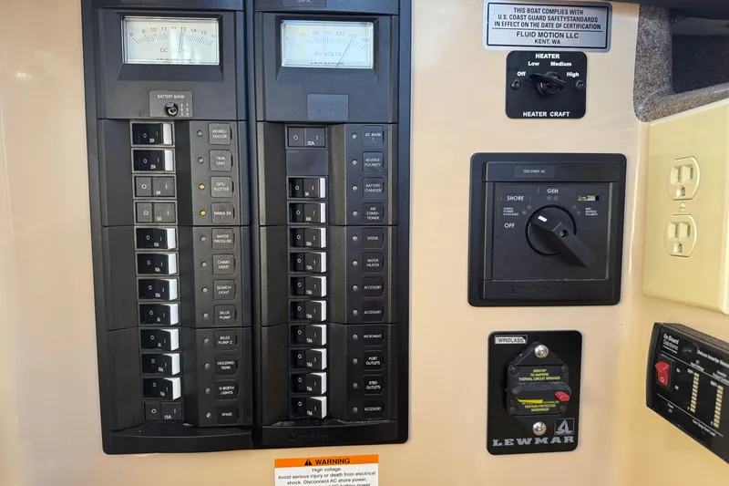 Slide: The Image of Electrical control panel of 2016 Ranger Tugs R-25SC boat with switches and meters. - 7