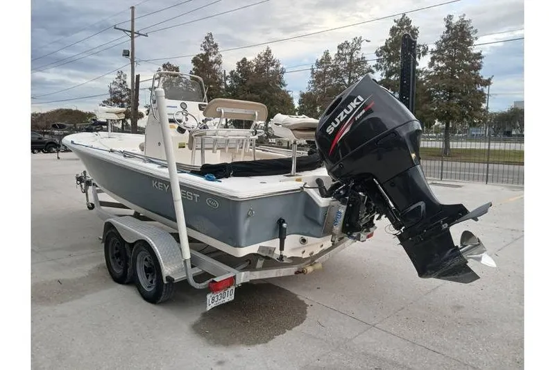 Slide: The Image of 2015 Key West 210 Bay Reef boat with Suzuki outboard motor on trailer. - 4