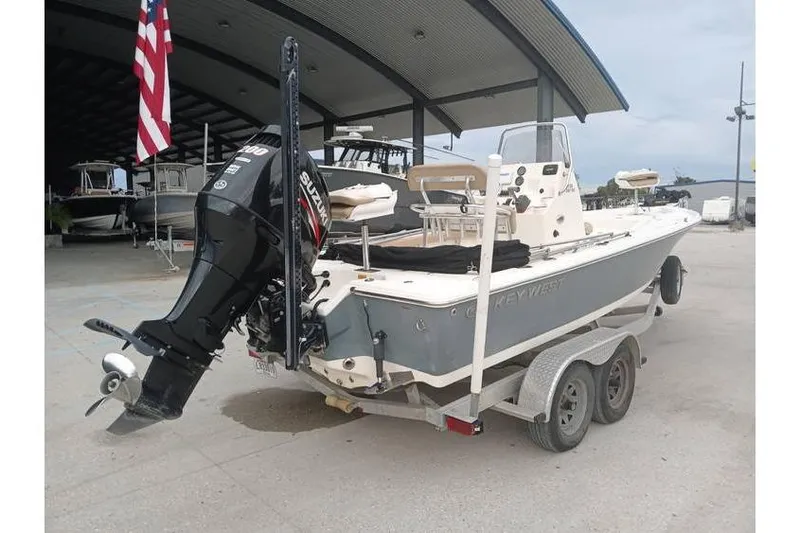 Slide: The Image of 2015 Key West 210 Bay Reef boat on trailer with Suzuki outboard motor. - 5