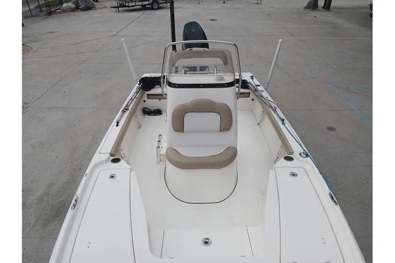 Slide: The Image of 2015 Key West 210 Bay Reef boat, white interior, center console, outdoor setting. - 6
