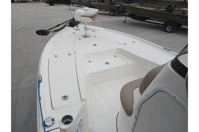 Slide: The Image of 2015 Key West 210 Bay Reef boat deck with seating and storage compartments. - 7