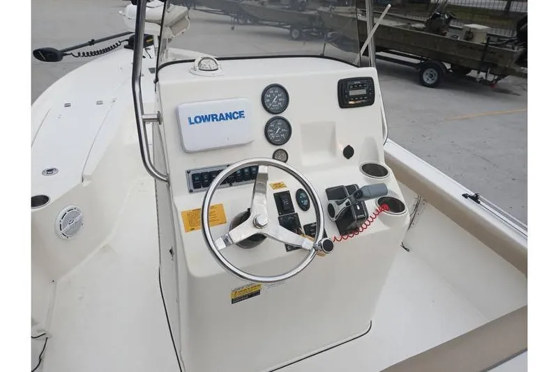 Slide: The Image of 2015 Key West 210 Bay Reef boat console with steering wheel and Lowrance equipment. - 9