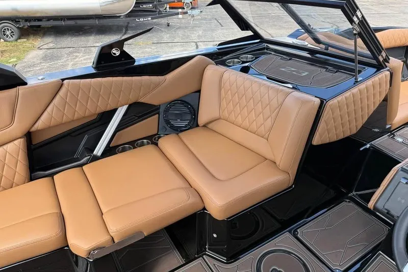Slide: The Image of 2026 Tigé Z3 boat interior with tan quilted seats and sleek black accents. - 13