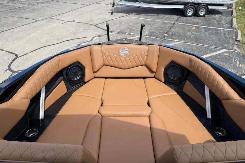 Slide: The Image of 2026 Tigé Z3 boat interior with tan leather seating and speakers. - 14