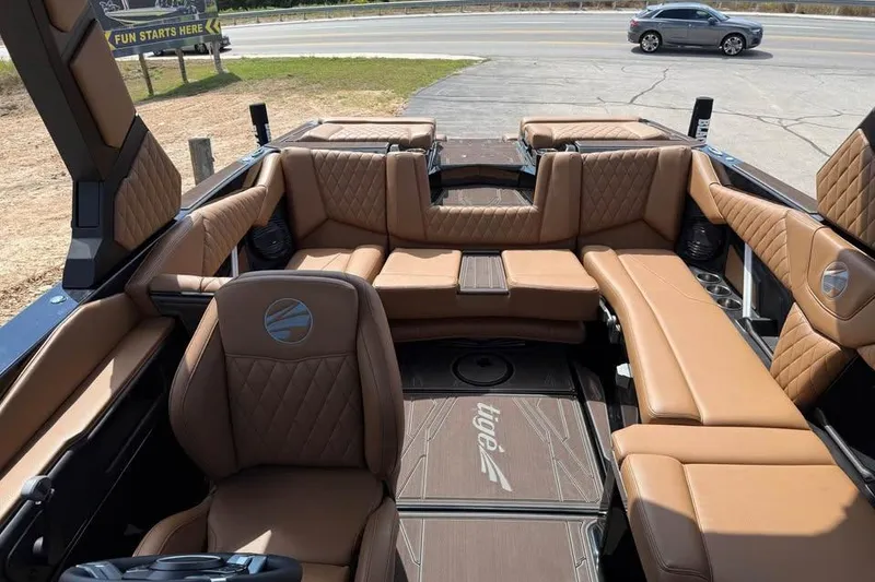 Slide: The Image of Luxurious interior of 2026 Tigé Z3 boat with brown leather seating and modern design. - 16