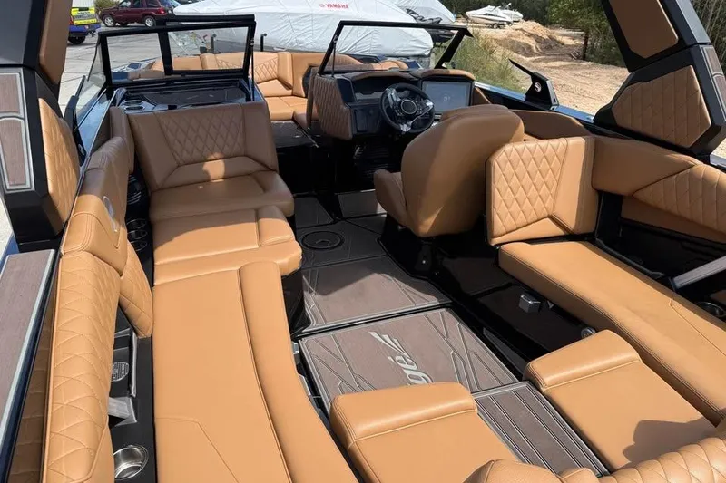 Slide: The Image of 2026 Tigé Z3 boat interior with luxurious tan leather seating and modern design. - 9
