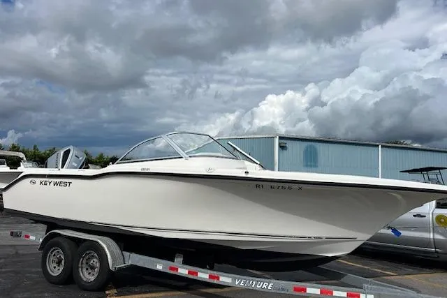 Slide: The Image of 2019 Key West 239 DFS boat on trailer under cloudy sky. - 3