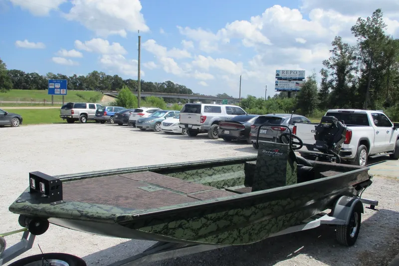 Slide: The Image of 2026 Gator Tail 1860 Extreme CC boat on trailer in parking lot. - 3